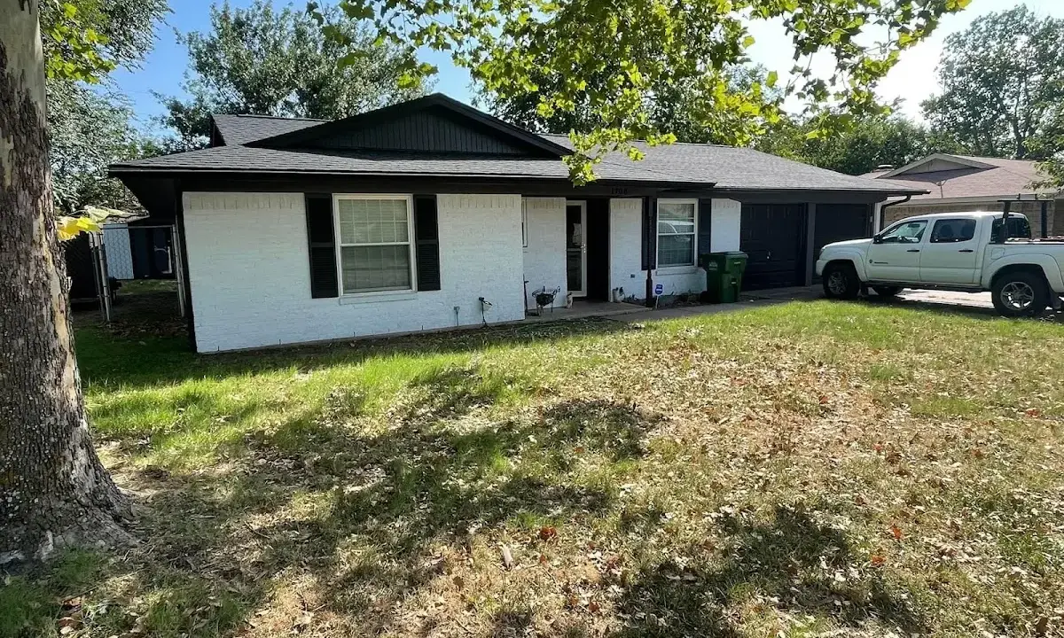 Professional roofing crew working on a residential roof in Salt Lake City